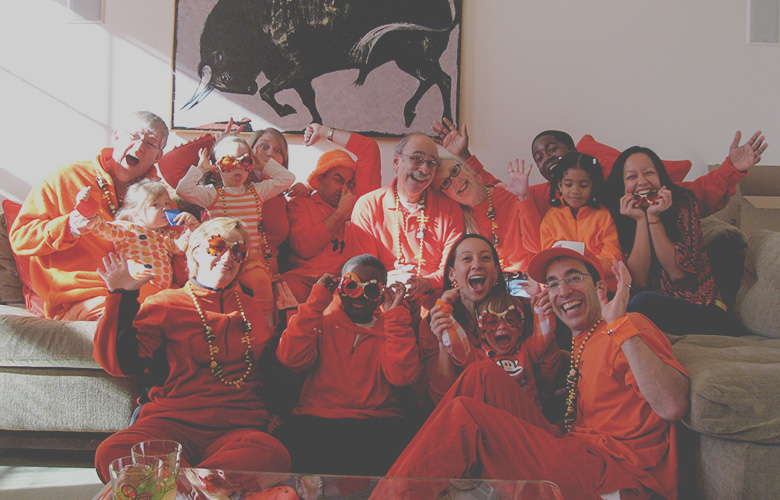 Family Traditions — Creating the Best Holiday Ever; 20 Family Members Dressed Head to Toe in Orange Plus 50 Stuffed Monkeys Is a Good Start